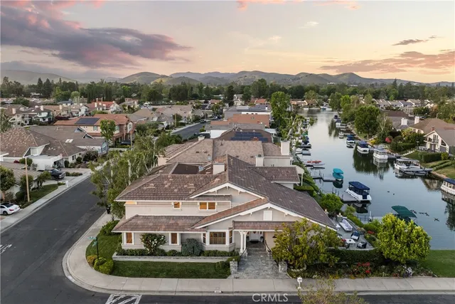 a view of a house with a mountain in the background