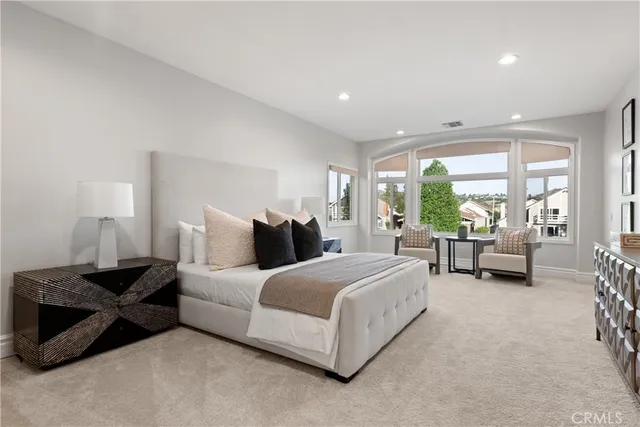 a bathroom with a granite countertop sink a large mirror and shower