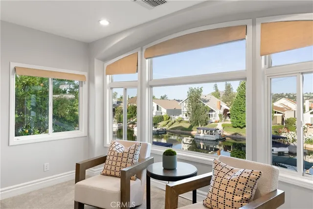 a view of a dining room with furniture window and outside view