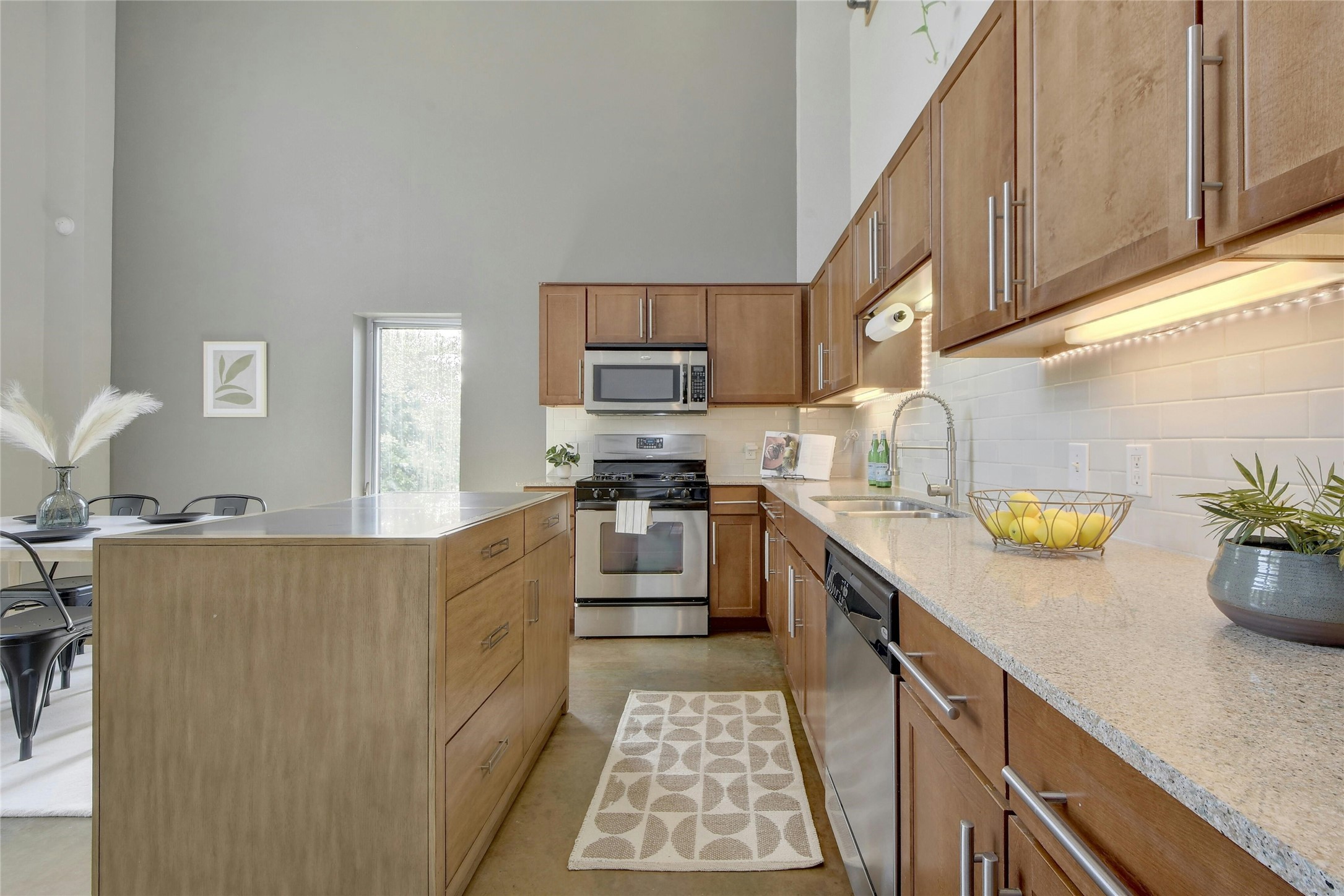 1601 East Cesar Chavez Street, Unit 201 Austin, TX 78702 - Photo 13 of 30 a kitchen with a sink stove and cabinets