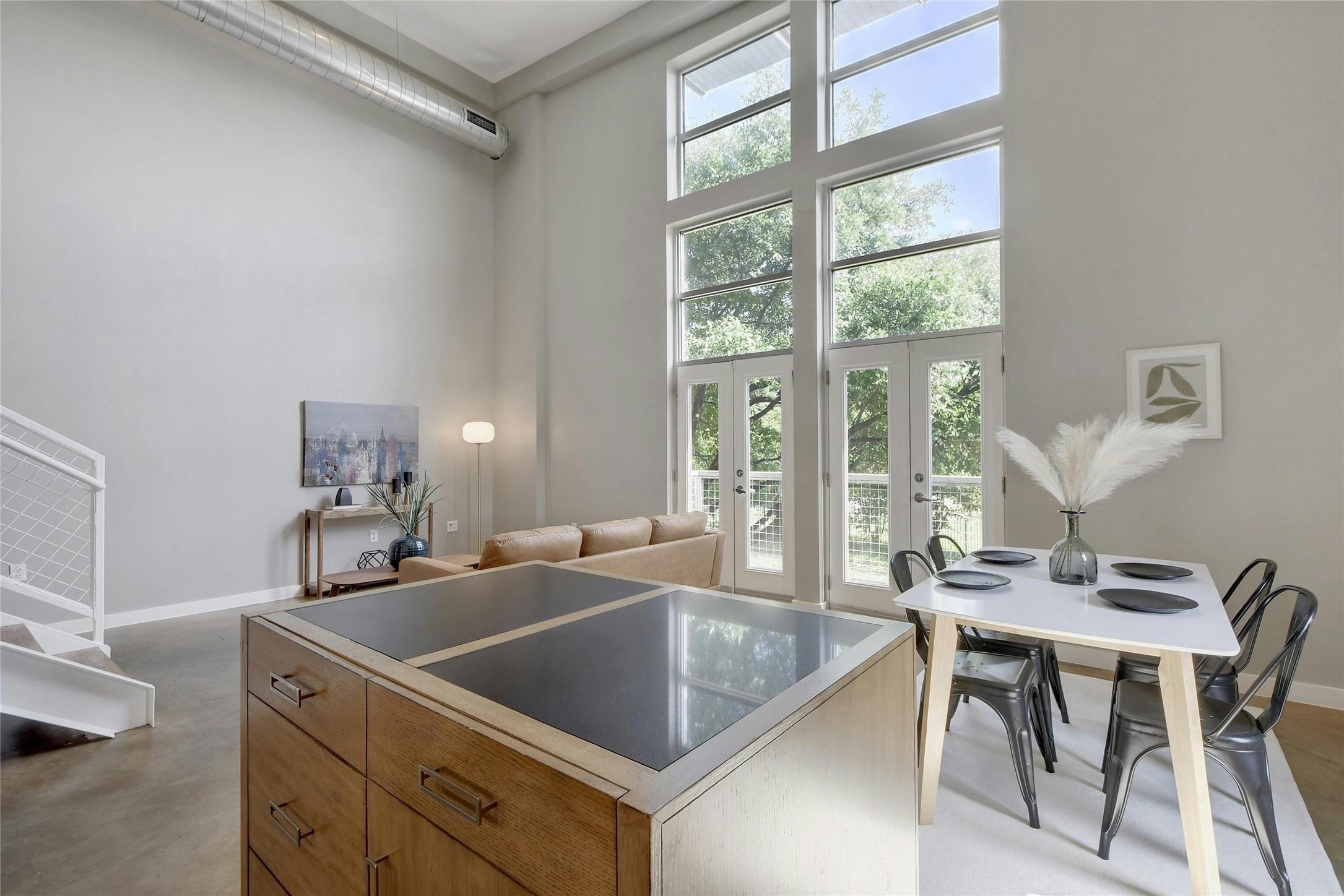 1601 East Cesar Chavez Street, Unit 201 Austin, TX 78702 - Photo 2 of 30 a kitchen with a table chairs and a sink