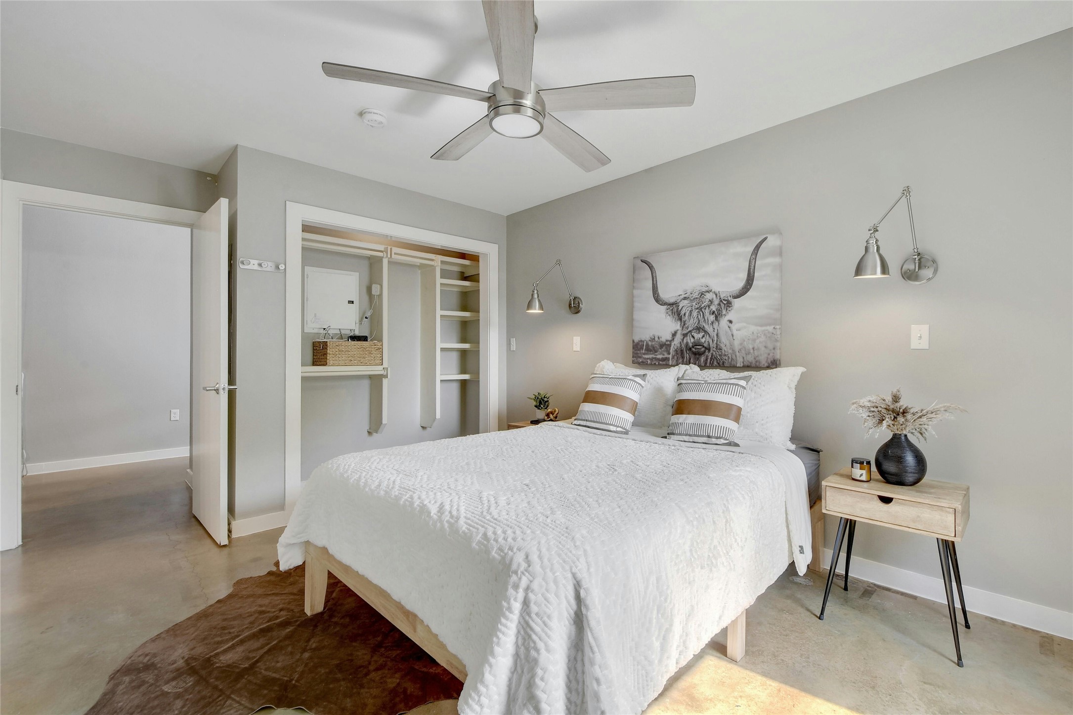 1601 East Cesar Chavez Street, Unit 201 Austin, TX 78702 - Photo 24 of 30 a bedroom with a bed and a table in it