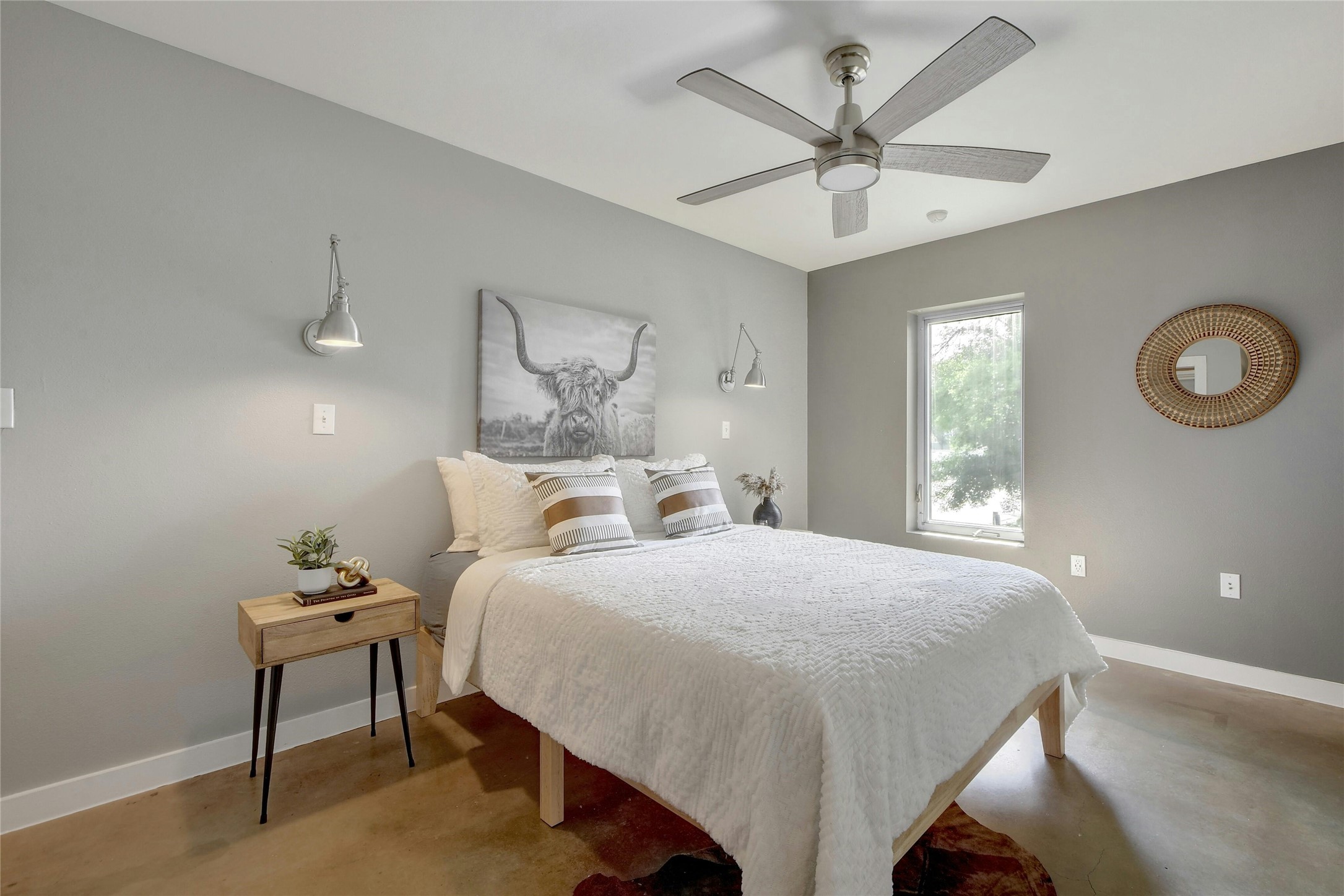 1601 East Cesar Chavez Street, Unit 201 Austin, TX 78702 - Photo 25 of 30 a bedroom with a bed and a chandelier
