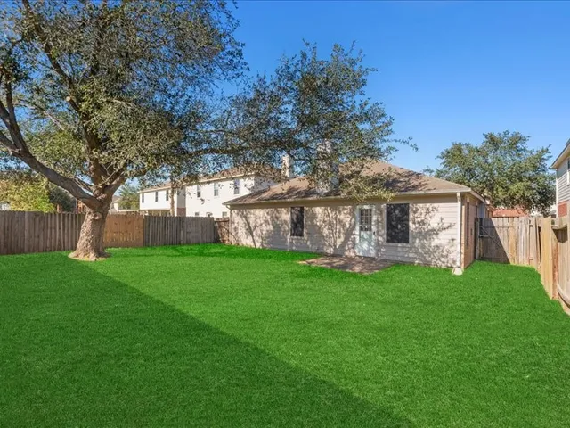 a view of a house with a back yard