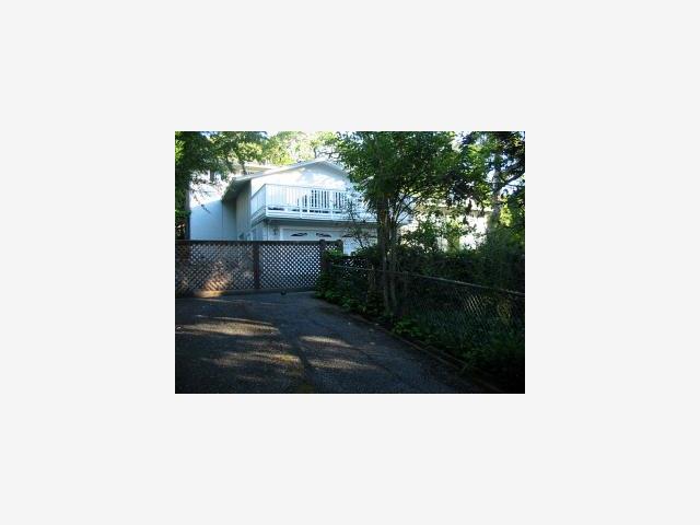 a picture of a bench in front of a building