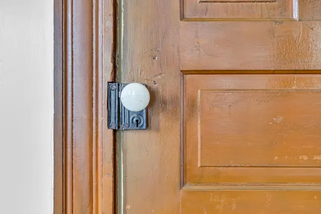 a bathroom with a shower and mirror