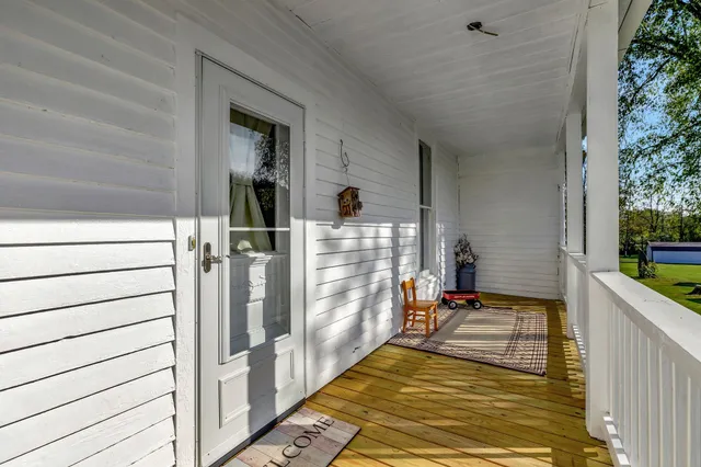 a view of hallway with seating space