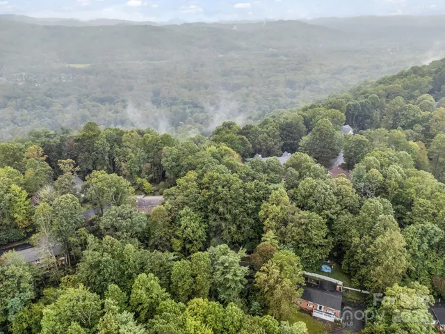 an aerial view of a houses with outdoor space