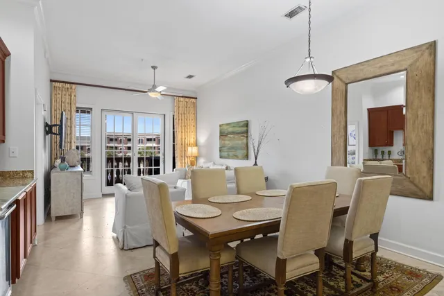 a living room with furniture a flat screen tv and a large window