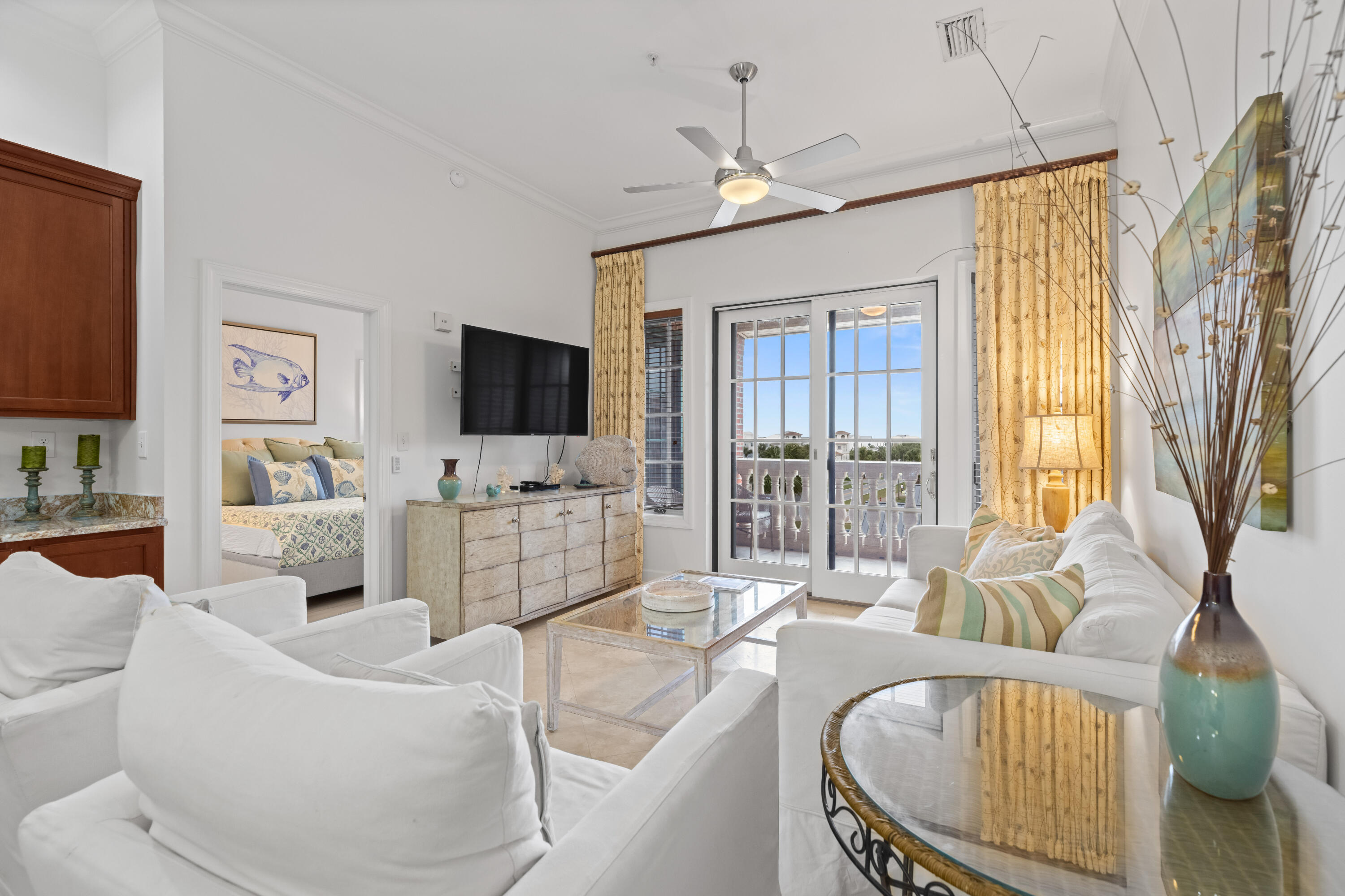 10343 East County Highway 30A, Unit 305 Inlet Beach, FL 32413 - Photo 12 of 32 a living room with furniture a flat screen tv and a large window