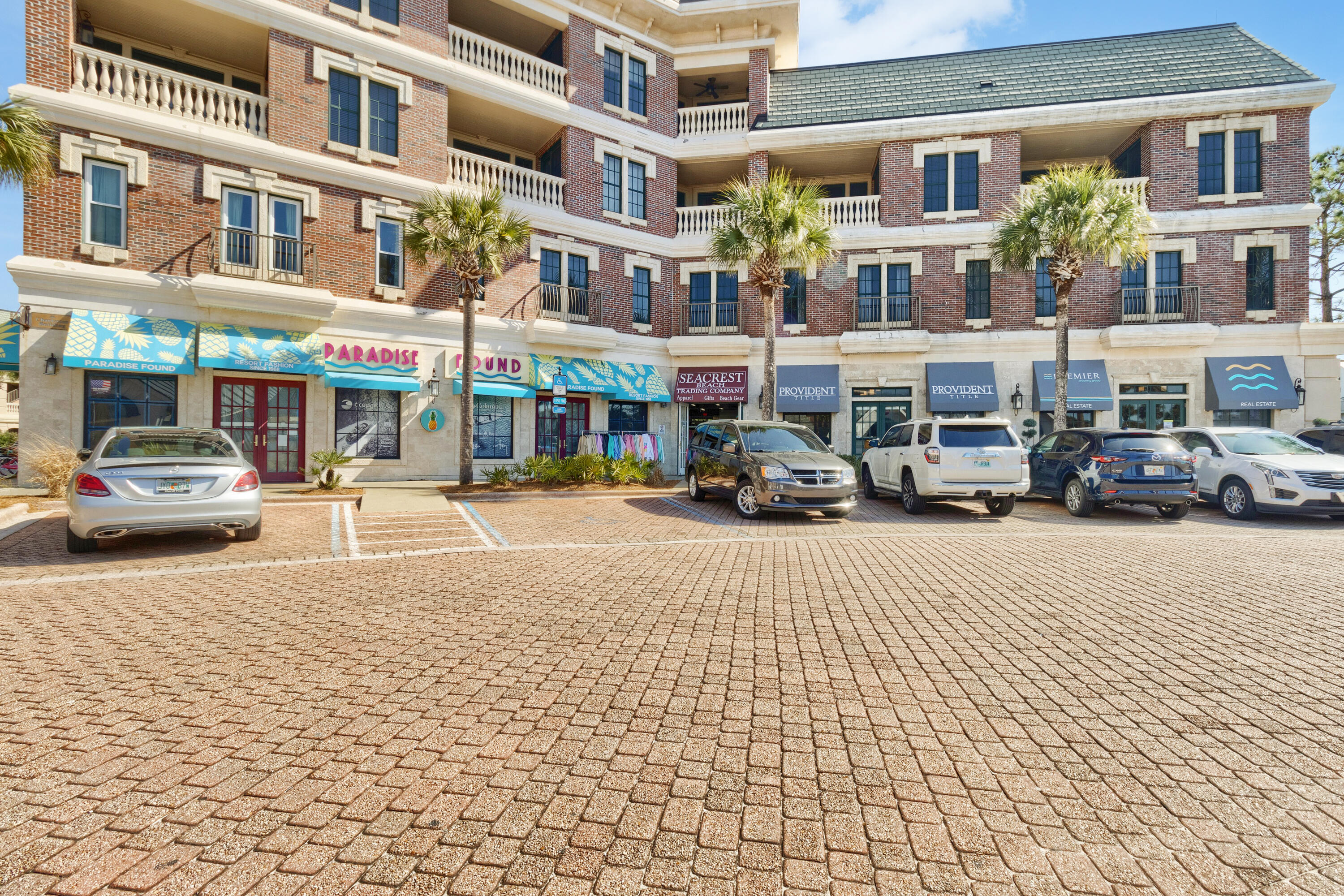 10343 East County Highway 30A, Unit 305 Inlet Beach, FL 32413 - Photo 20 of 60 a building with cars parked in front of it