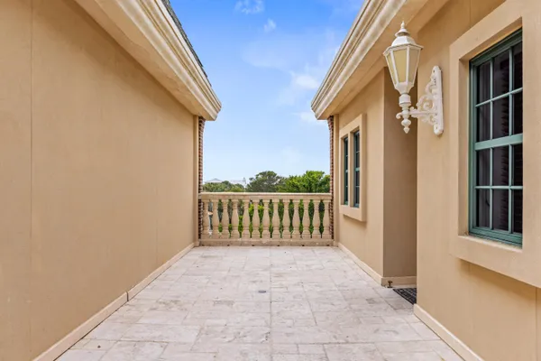 a view of a balcony with wooden floor and city view