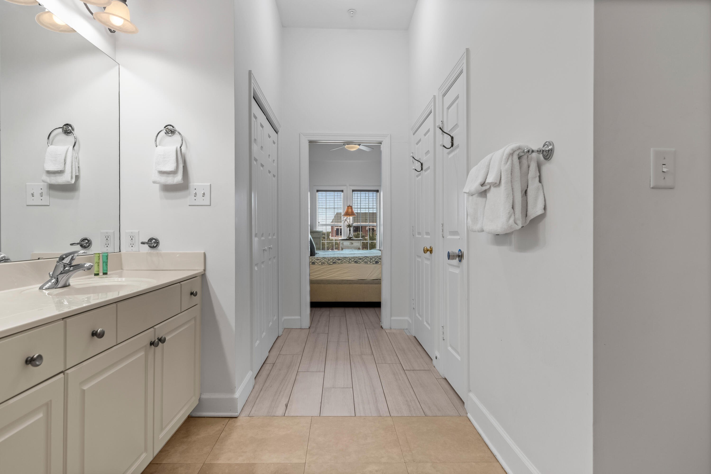10343 East County Highway 30A, Unit 305 Inlet Beach, FL 32413 - Photo 26 of 32 a bathroom with a double vanity sink and mirror