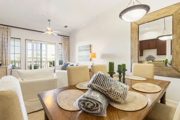 a living room with furniture and a floor to ceiling window