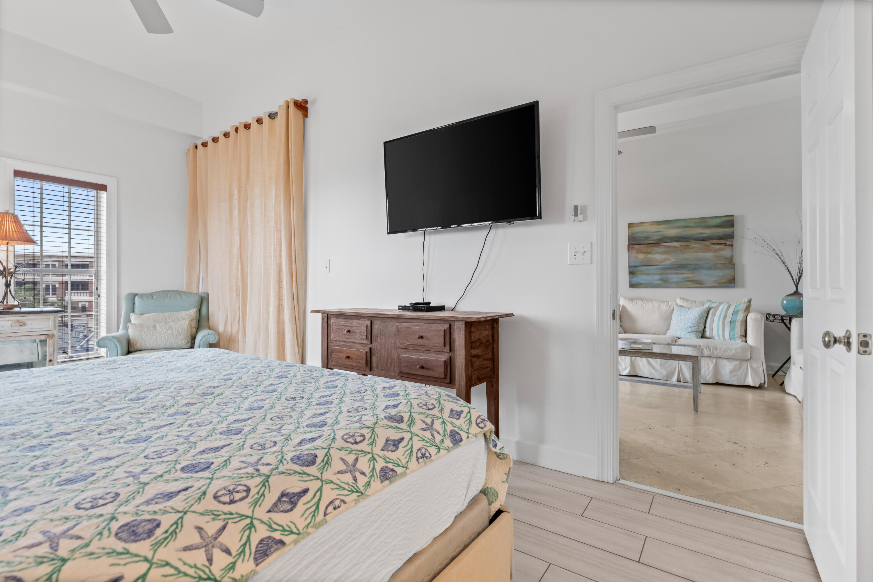 10343 East County Highway 30A, Unit 305 Inlet Beach, FL 32413 - Photo 46 of 60 a bedroom with a bed and a flat screen tv