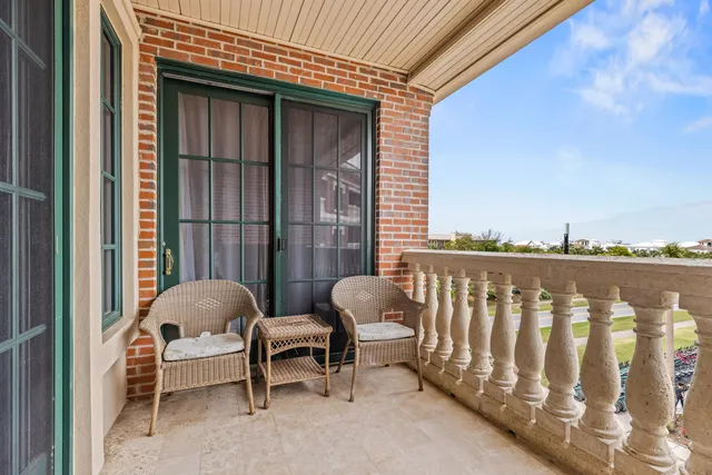 a view of a balcony with furniture