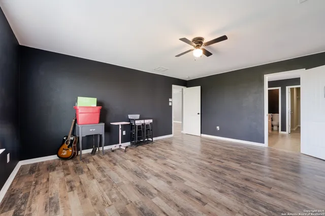 a bathroom with a granite countertop sink mirror and a bathtub