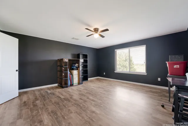 a bedroom with bed and window