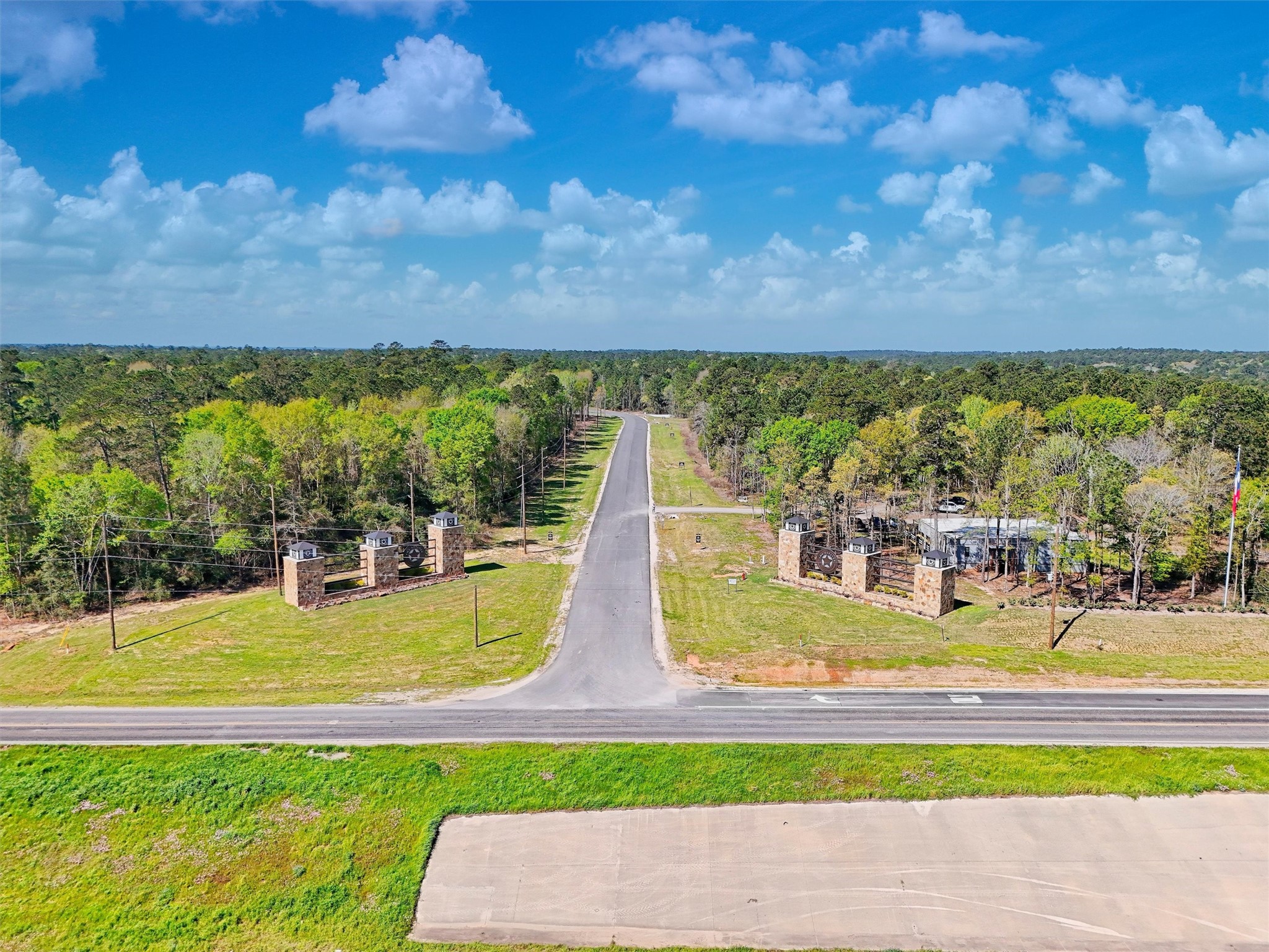 111 Rustic Ranch Drive New Waverly, TX 77358 - Photo 7 of 9 Beautifully designed community entrance with easy access to main roads, combining peaceful living with accessibility for commuting.