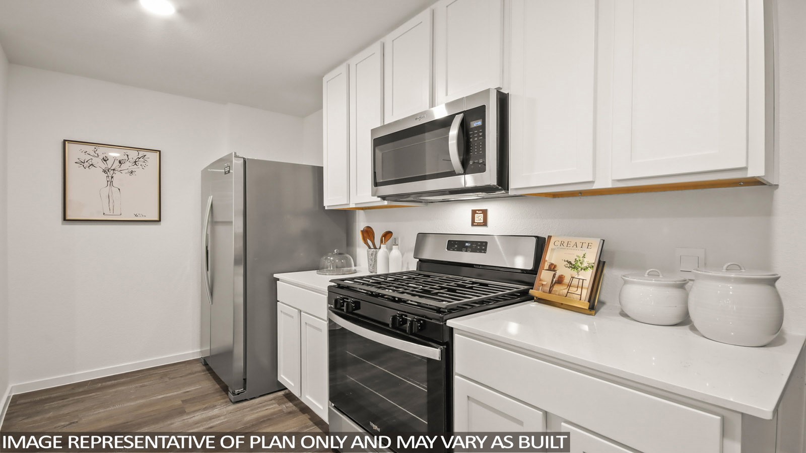 949 Sutherland Falls Street Conroe, TX 77303 - Photo 2 of 30 a kitchen with stainless steel appliances granite countertop a refrigerator stove and microwave