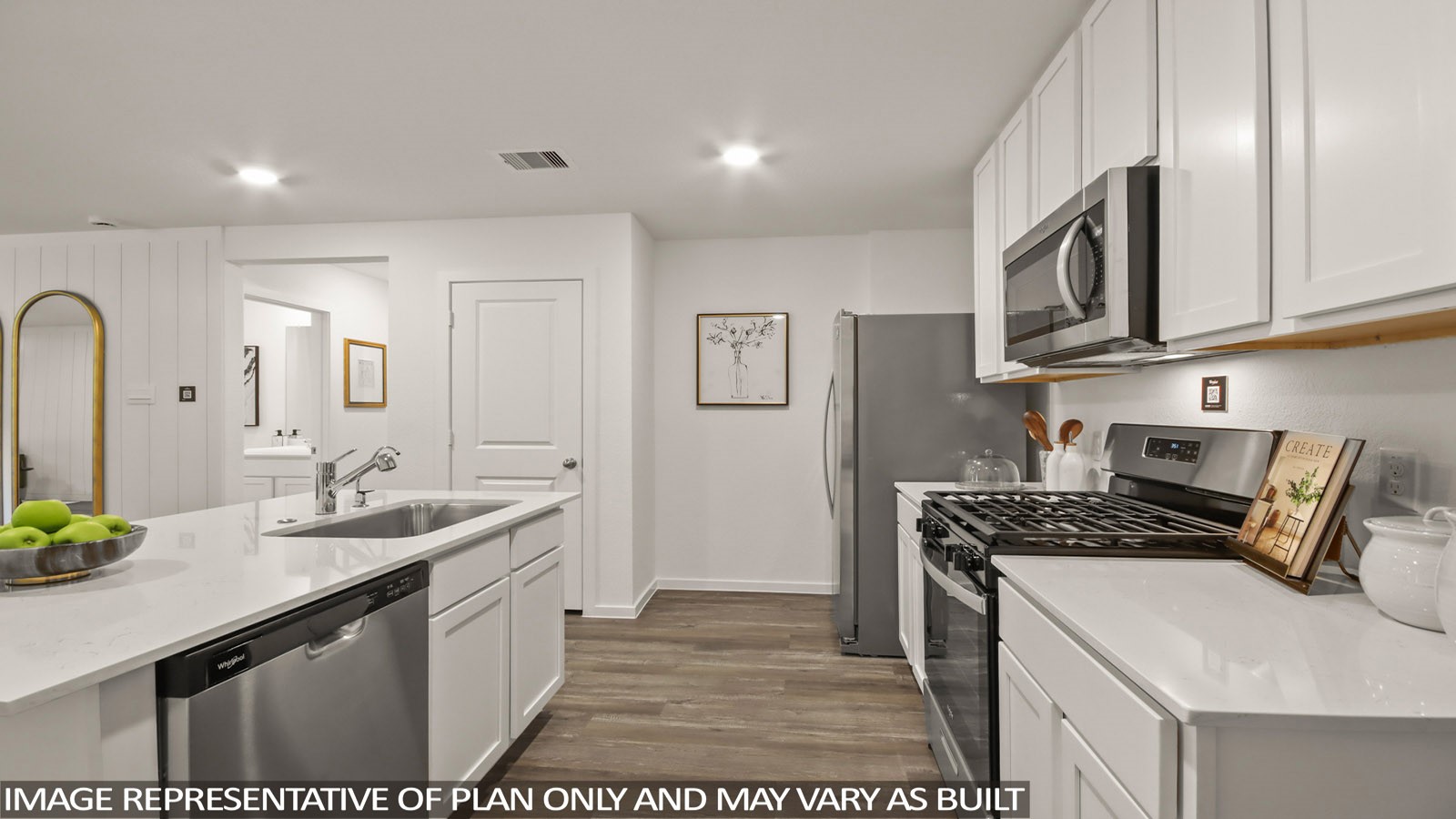 949 Sutherland Falls Street Conroe, TX 77303 - Photo 3 of 30 a kitchen with stainless steel appliances granite countertop a sink stove and cabinets