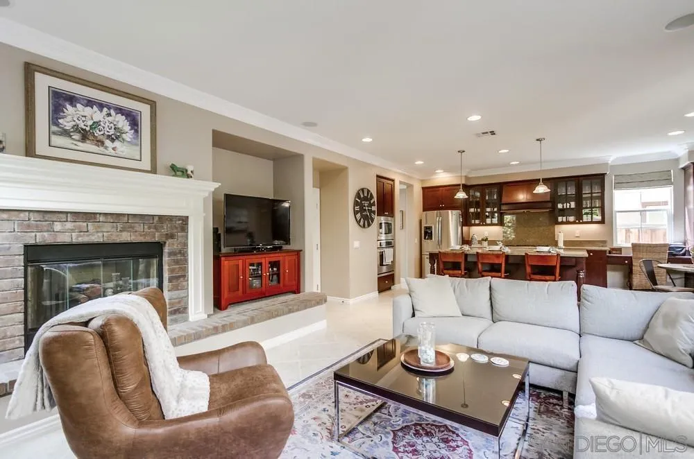 2665 Paradise Road Carlsbad, CA 92009 - Photo 14 of 52 a living room with furniture and a fireplace