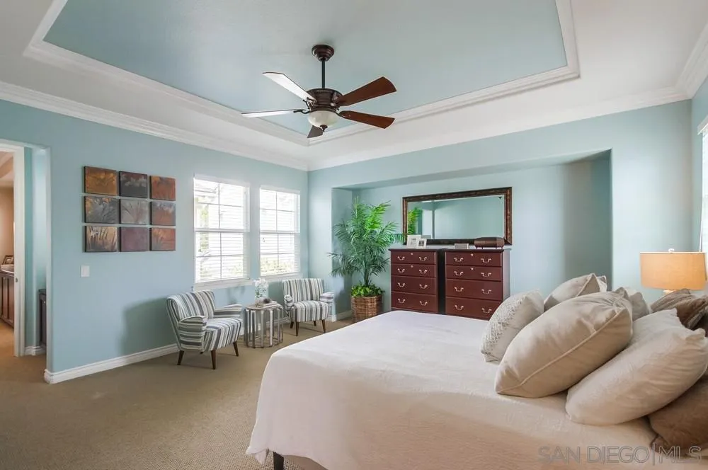 2665 Paradise Road Carlsbad, CA 92009 - Photo 20 of 52 a bedroom with a bed and a chair