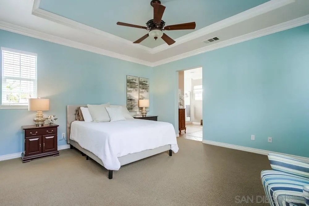 2665 Paradise Road Carlsbad, CA 92009 - Photo 21 of 52 a bedroom with a bed and window