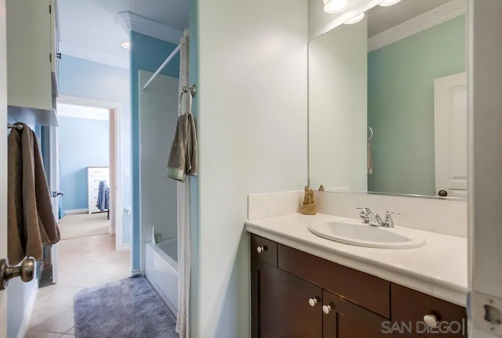 2665 Paradise Road Carlsbad, CA 92009 - Photo 27 of 52 a en suite bathroom with a sink and a mirror