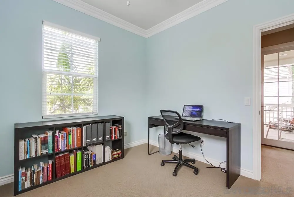 2665 Paradise Road Carlsbad, CA 92009 - Photo 28 of 52 a view of a workspace with bookshelf and a window