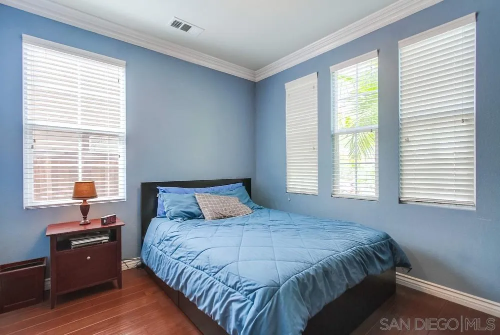 2665 Paradise Road Carlsbad, CA 92009 - Photo 29 of 52 a bedroom with a bed and a window