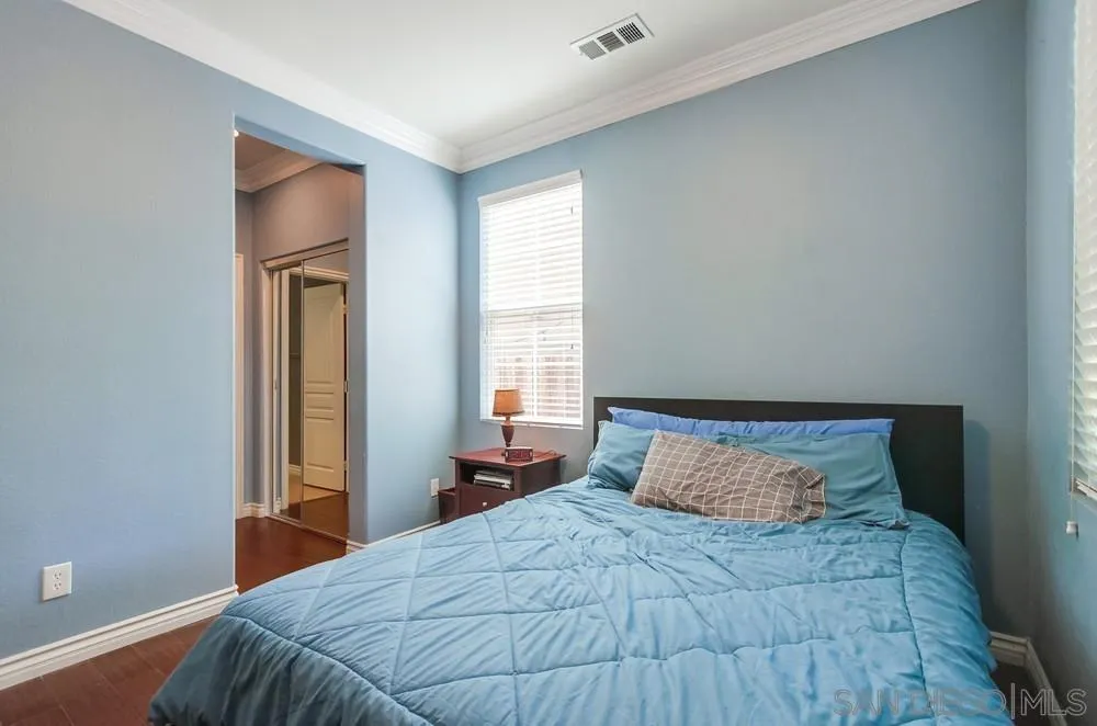 2665 Paradise Road Carlsbad, CA 92009 - Photo 30 of 52 a bedroom with a bed and a window