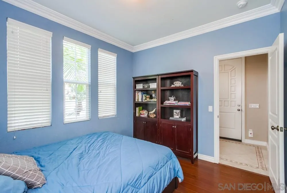 2665 Paradise Road Carlsbad, CA 92009 - Photo 31 of 52 a bedroom with a large bed and closet