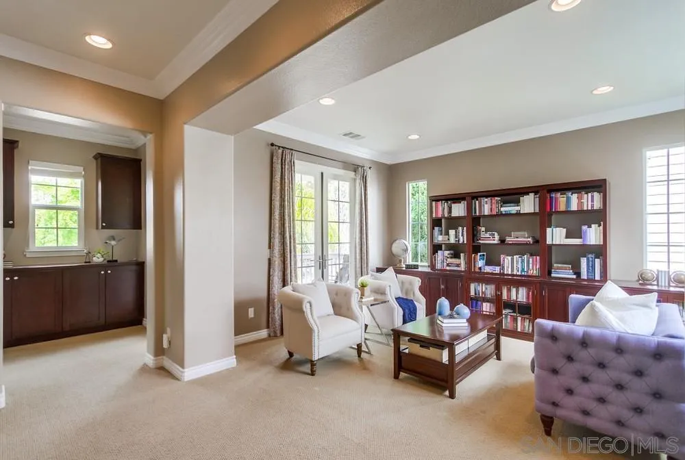 2665 Paradise Road Carlsbad, CA 92009 - Photo 33 of 52 a living room with furniture and a bookshelf