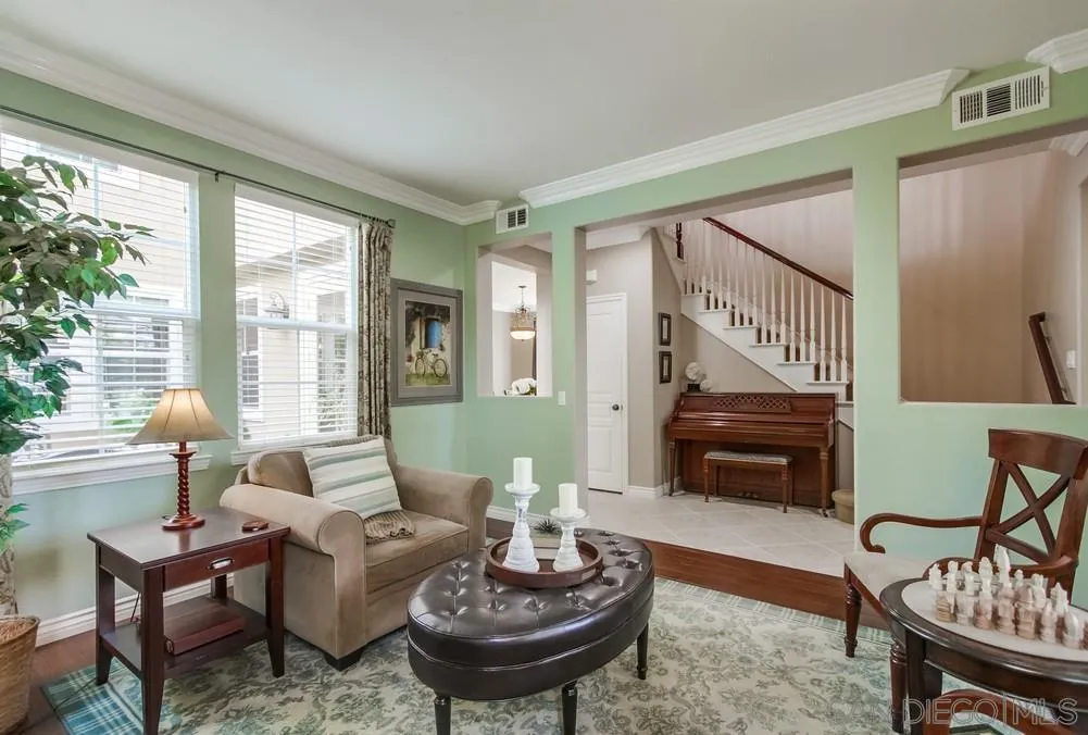 2665 Paradise Road Carlsbad, CA 92009 - Photo 4 of 52 a living room with furniture and a wooden floor