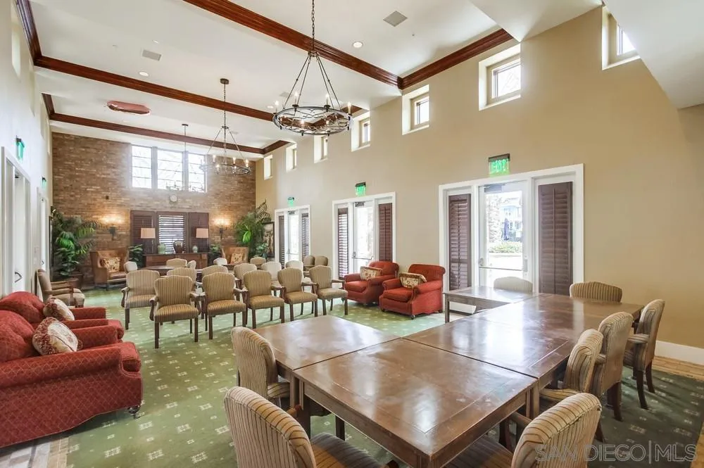 2665 Paradise Road Carlsbad, CA 92009 - Photo 44 of 52 a living room with furniture a chandelier and a dining table
