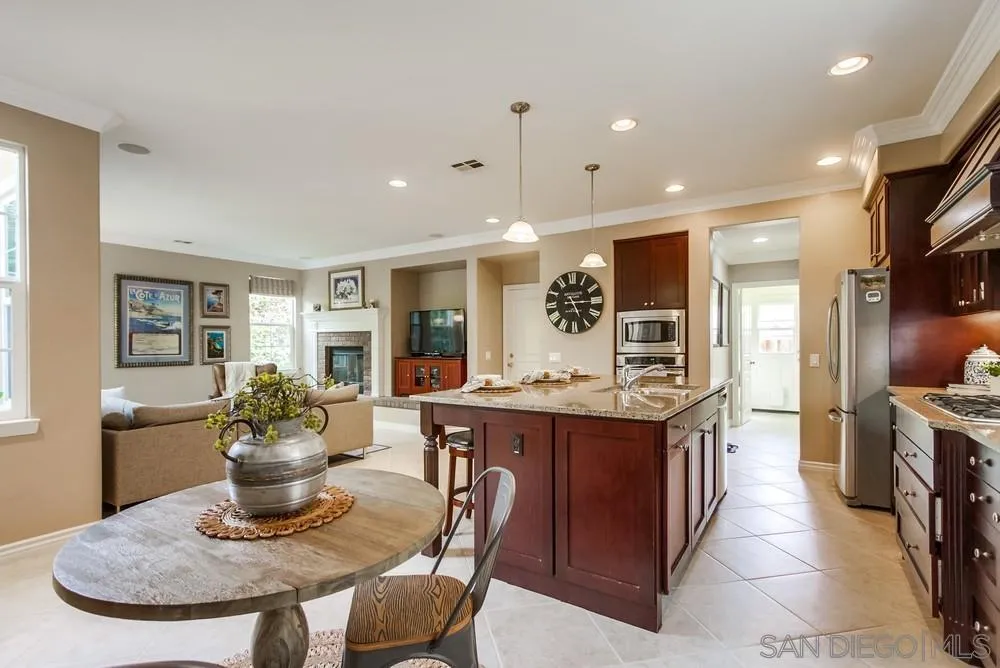 2665 Paradise Road Carlsbad, CA 92009 - Photo 8 of 52 a kitchen with a table and chairs in it
