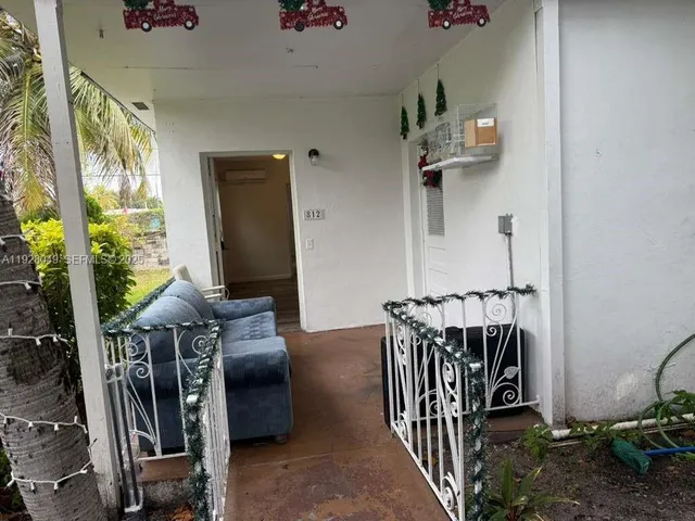 a kitchen with a sink a refrigerator a stove top oven and cabinets
