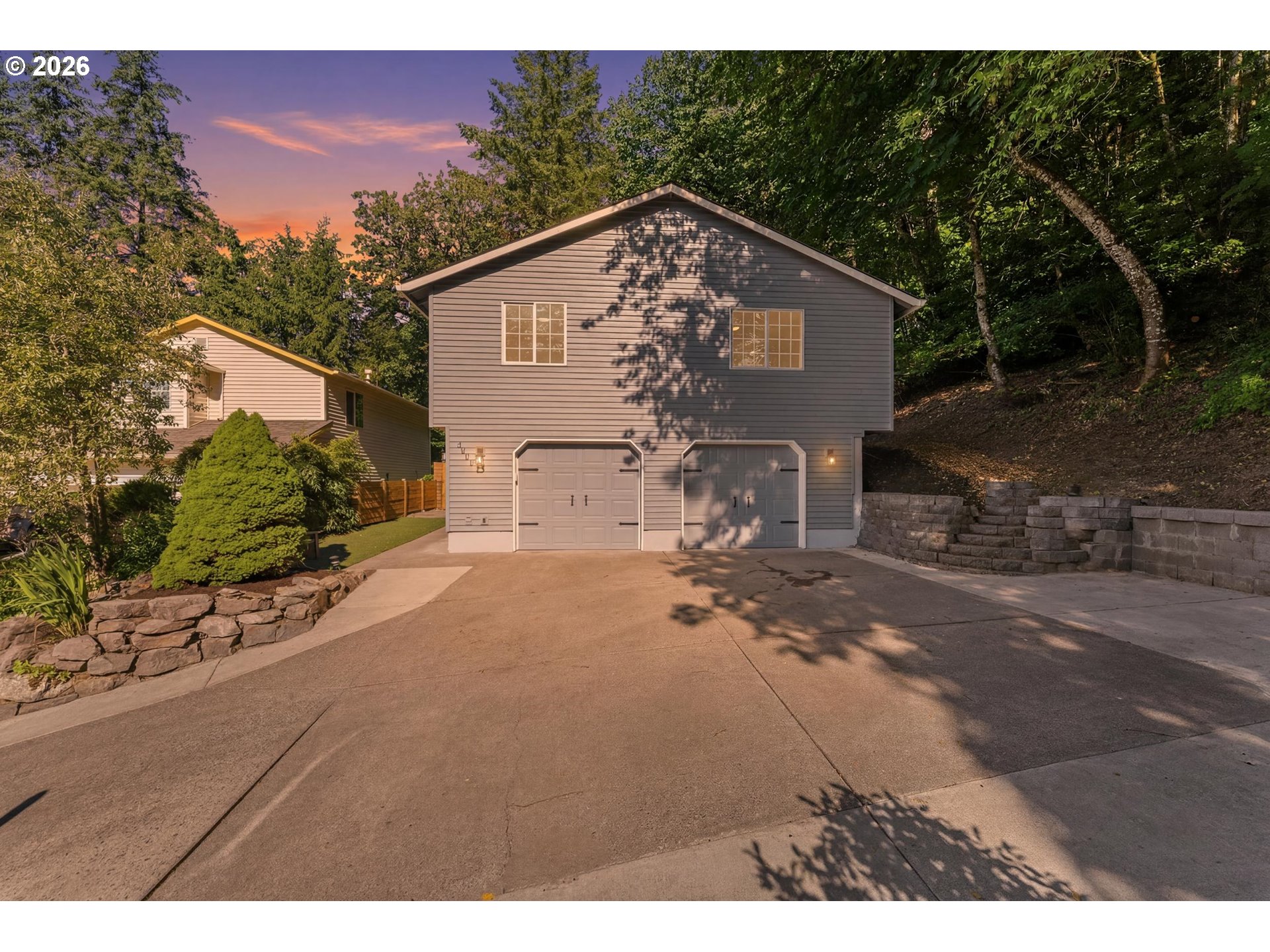 4024 Southeast 154th Place Portland, OR 97236 - Photo 2 of 43 a view of a house with backyard and garden