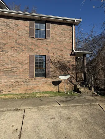 a brick building with a bench and a bench