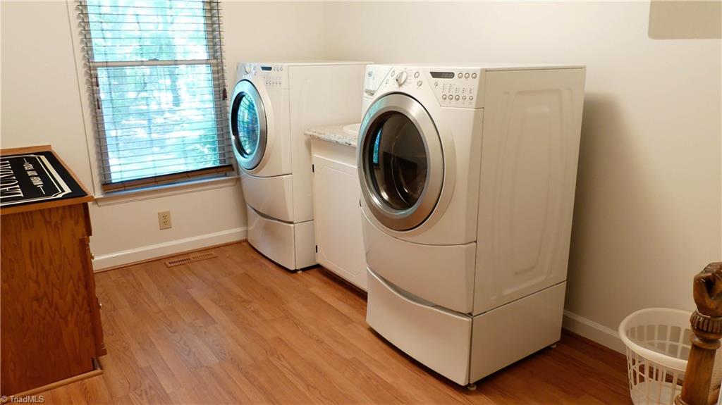 1130 Flinty Knoll Road Pinnacle, NC 27043 - Photo 13 of 29 Very spacious laundry room with plenty of room for a folding table and drying rack. Your ironing board is already built in to the wall!