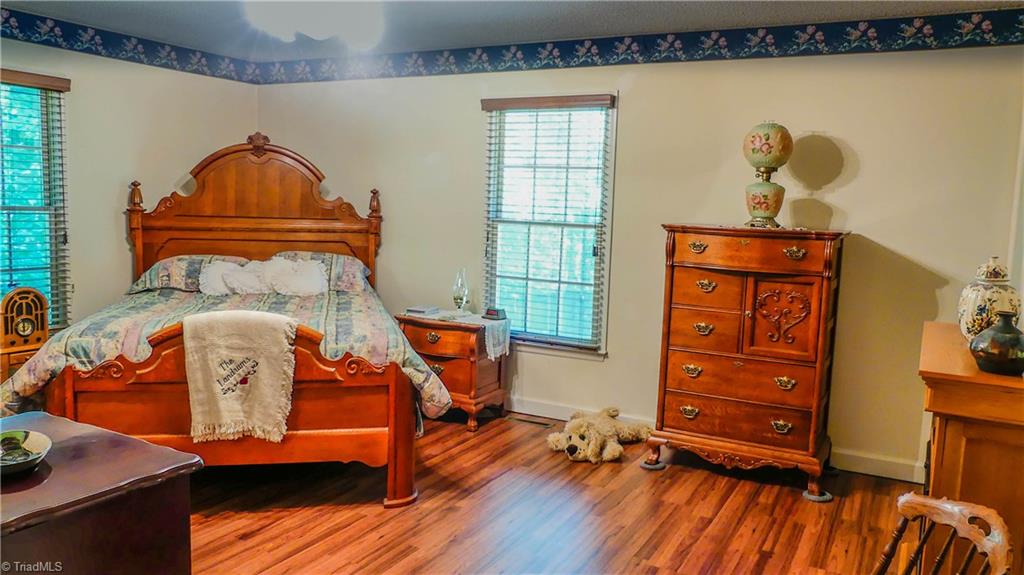 1130 Flinty Knoll Road Pinnacle, NC 27043 - Photo 18 of 29 This Master Bedroom features new flooring and a walk-in closet. Just add your personal touches to make it yours!