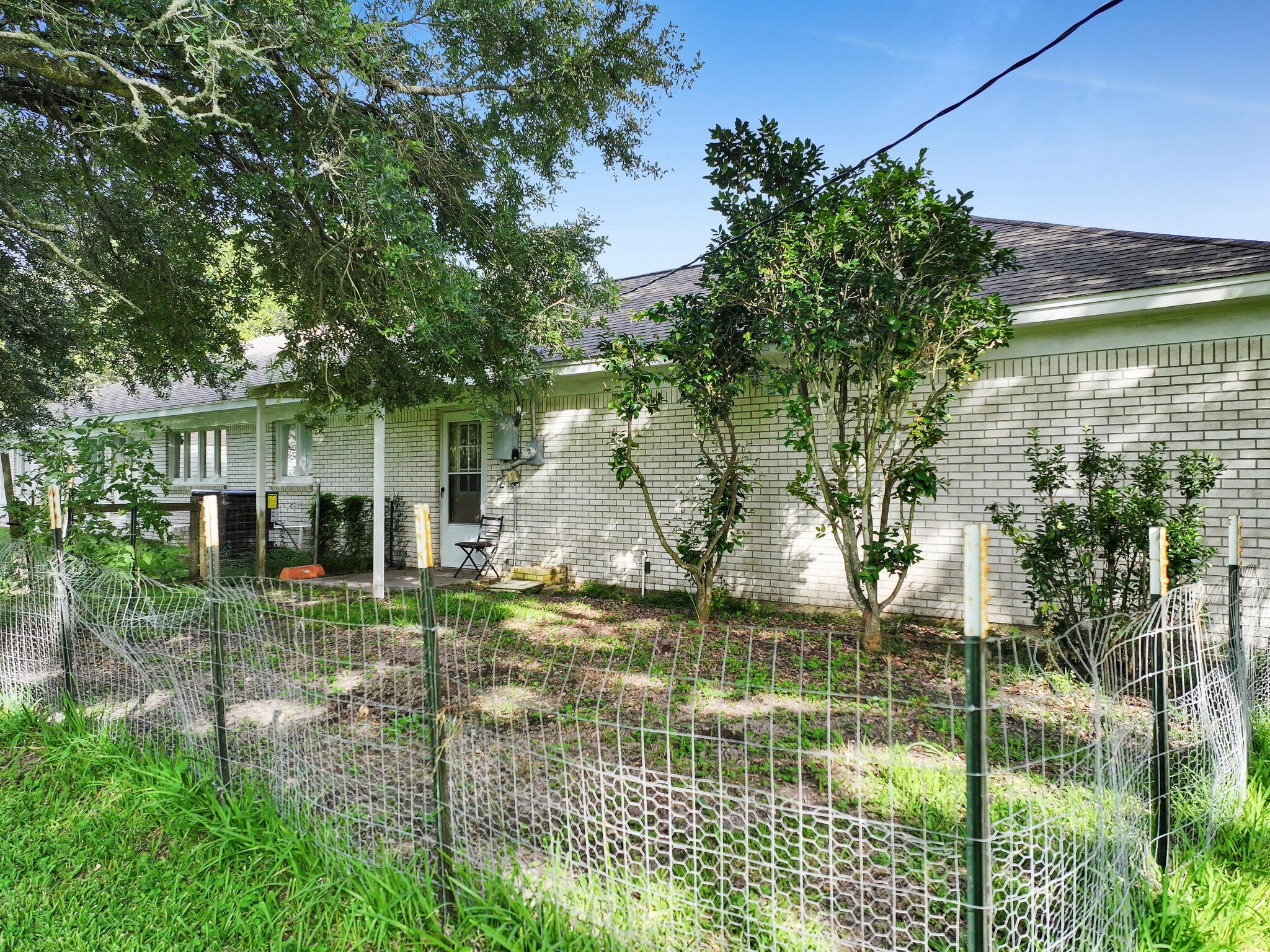 1212 High School Road Port Bolivar, TX 77650 - Photo 13 of 50 a front view of a house with a yard