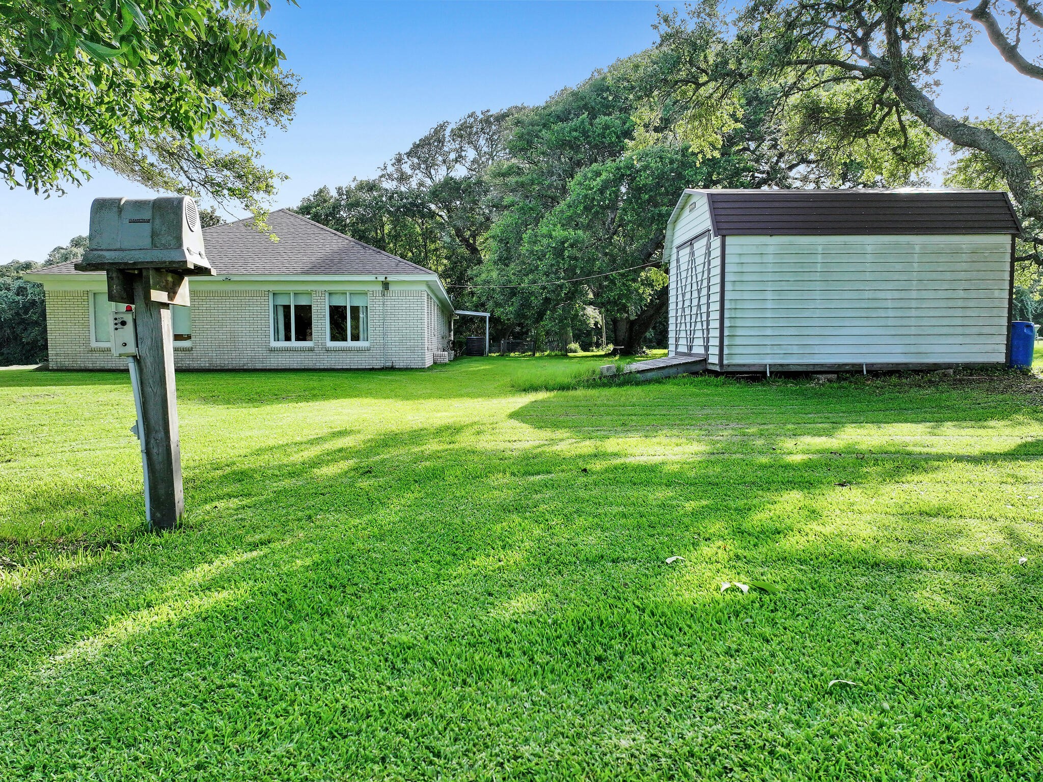 1212 High School Road Port Bolivar, TX 77650 - Photo 15 of 50 a front view of a house with a garden