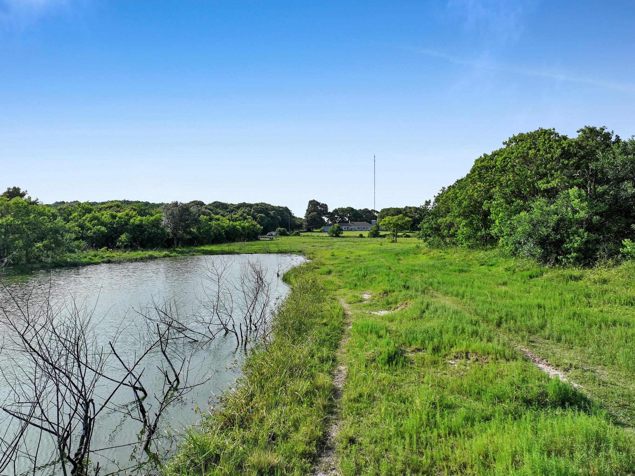 1212 High School Road Port Bolivar, TX 77650 - Photo 17 of 50 a view of a lake with houses in the back