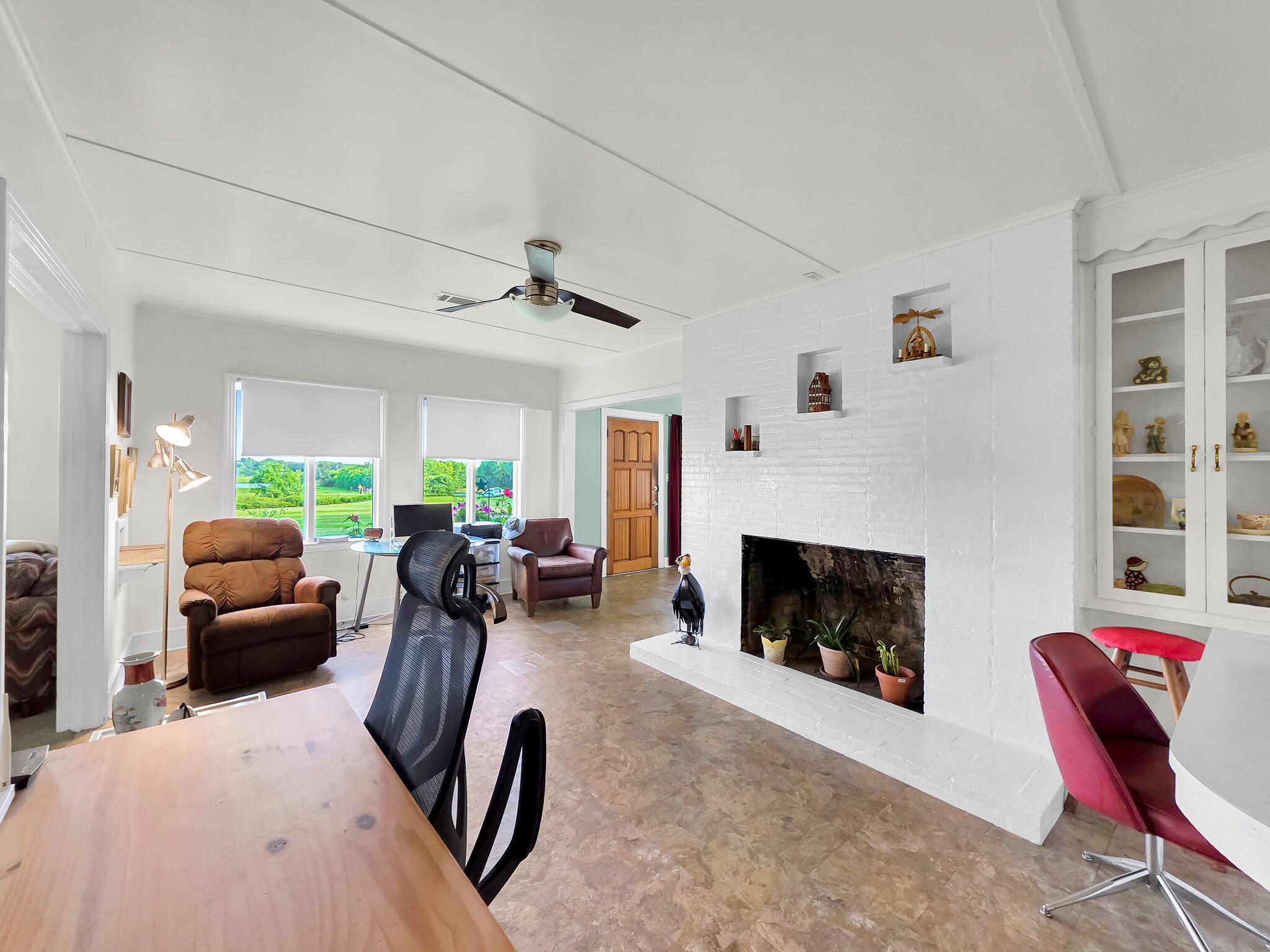 1212 High School Road Port Bolivar, TX 77650 - Photo 38 of 50 a living room with furniture a fireplace and a large window