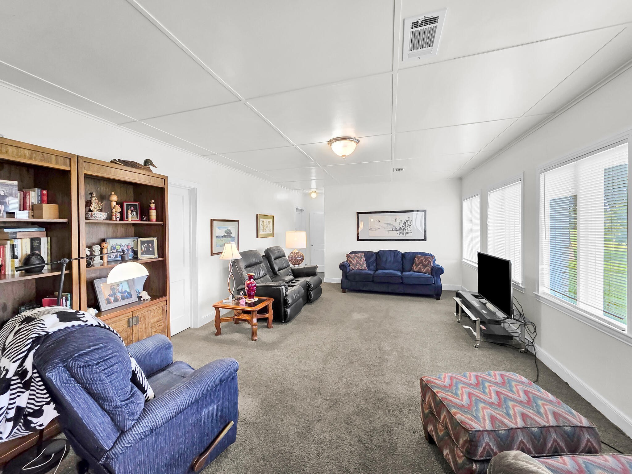 1212 High School Road Port Bolivar, TX 77650 - Photo 41 of 50 a living room with furniture a window and a flat screen tv