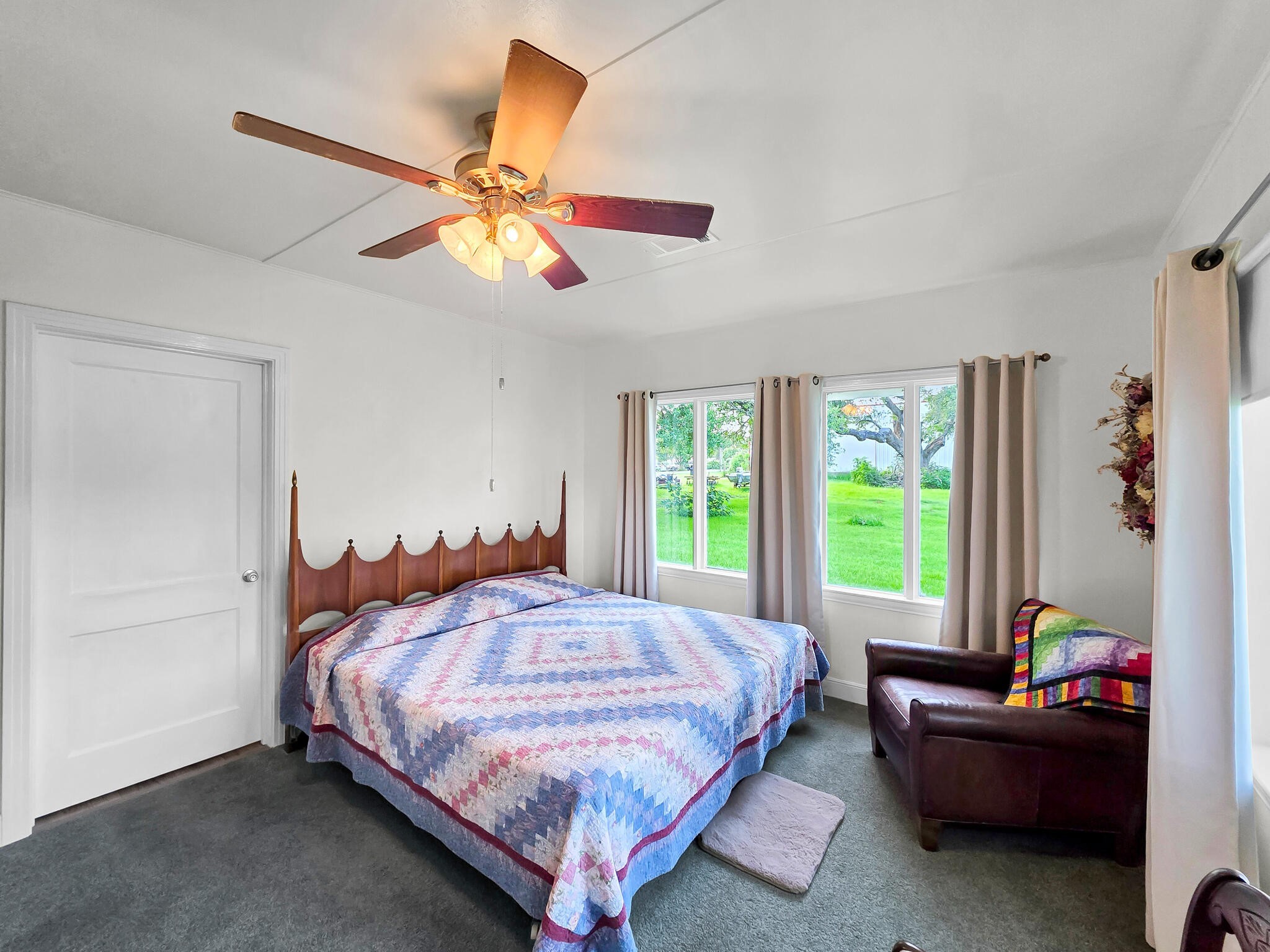 1212 High School Road Port Bolivar, TX 77650 - Photo 50 of 50 a bedroom with a bed and a chandelier