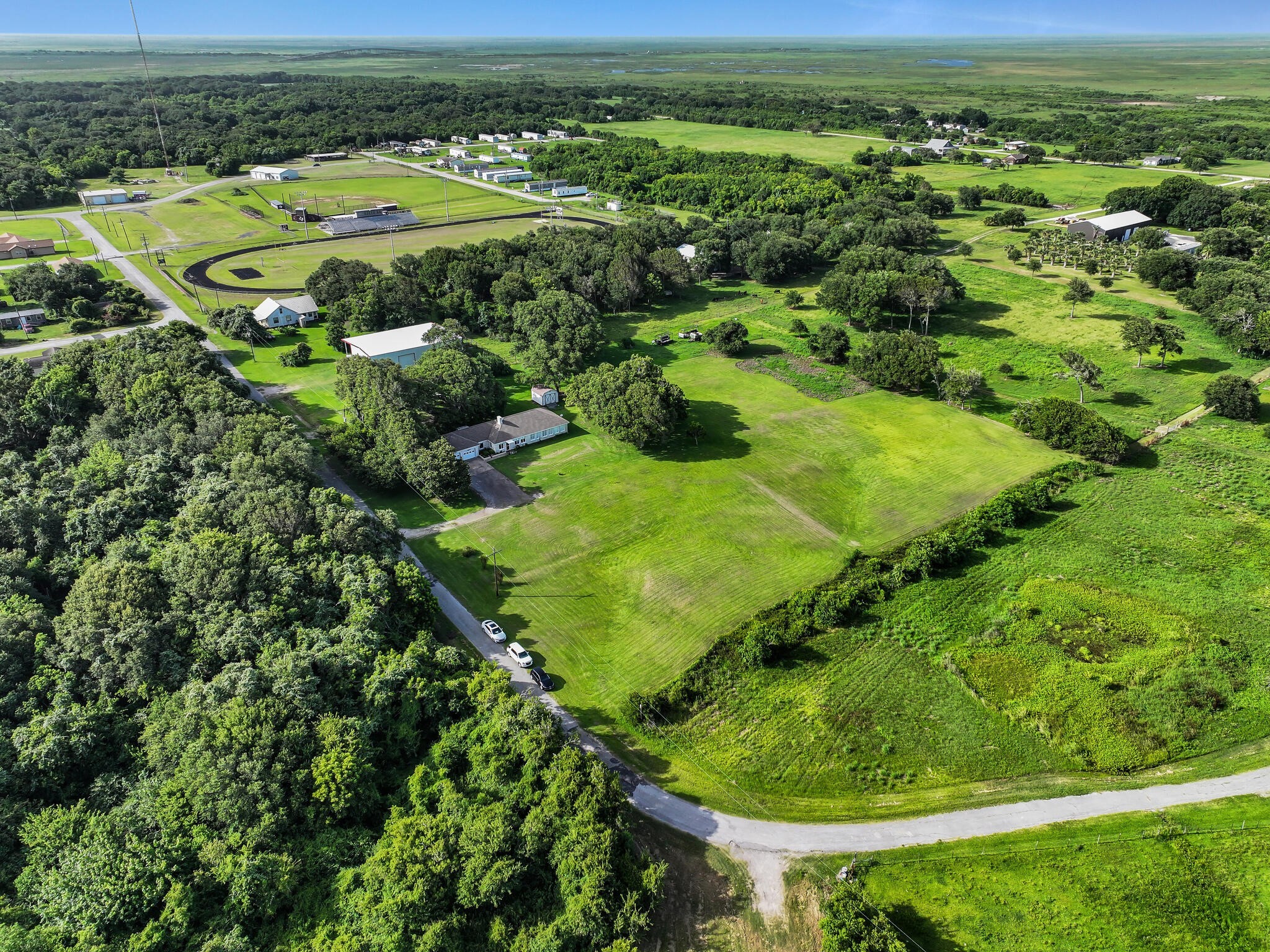 1212 High School Road Port Bolivar, TX 77650 - Photo 5 of 50 an aerial view of a golf course with outdoor space