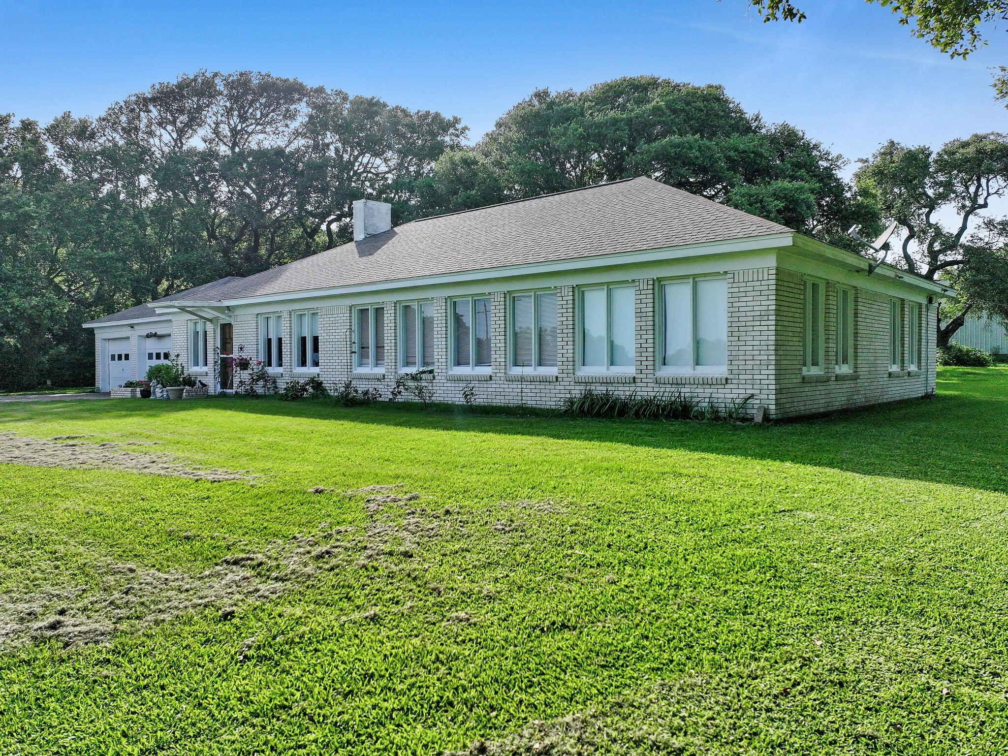 1212 High School Road Port Bolivar, TX 77650 - Photo 9 of 50 a view of a house with a garden